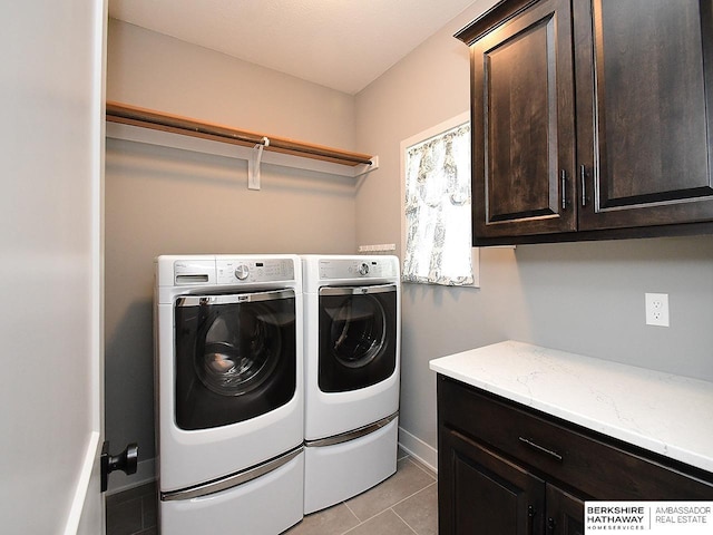 10309 S 102nd St, Papillion, NE 68046 - laundry area featuring cabinet space, washer and dryer, and light tile patterned floors