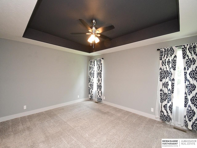 10309 S 102nd St, Papillion, NE 68046 - carpeted empty room with a tray ceiling and ceiling fan