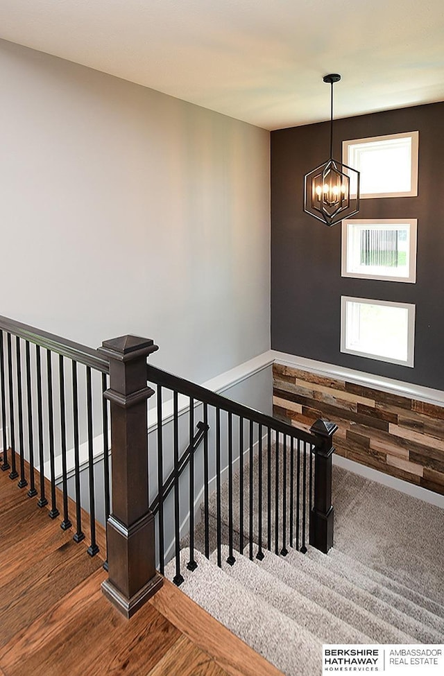 10309 S 102nd St, Papillion, NE 68046 - staircase featuring a chandelier and wood finished floors