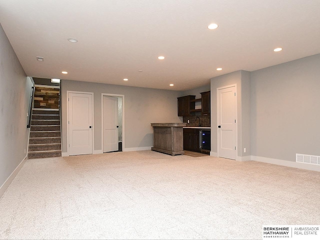 10309 S 102nd St, Papillion, NE 68046 - unfurnished living room with recessed lighting, light carpet, and stairs