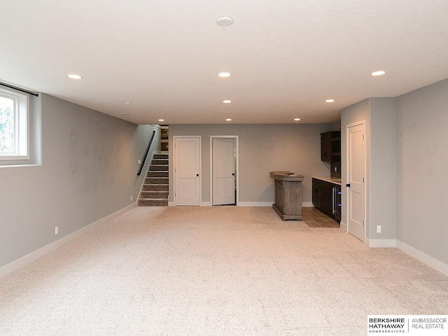 10309 S 102nd St, Papillion, NE 68046 - basement featuring light colored carpet, stairs, and recessed lighting