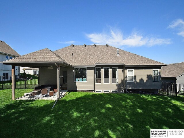 10309 S 102nd St, Papillion, NE 68046 - back of property featuring a fenced backyard, a patio area, a shingled roof, and a ceiling fan