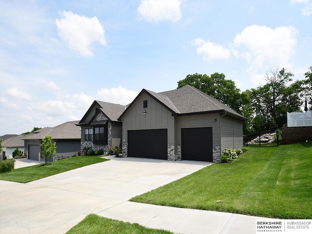 10309 S 102nd St, Papillion, NE 68046 - view of front of house with an attached garage, a front yard, board and batten siding, concrete driveway, and roof with shingles