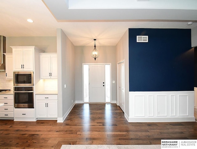 10309 S 102nd St, Papillion, NE 68046 - entryway featuring dark wood-style flooring and recessed lighting