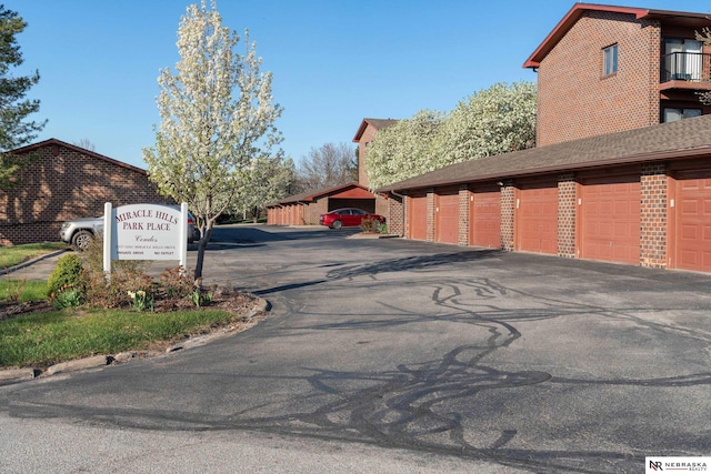 11937 Miracle Hills Dr Unit 11, Omaha, NE 68154 - view of asphalt road with community garages