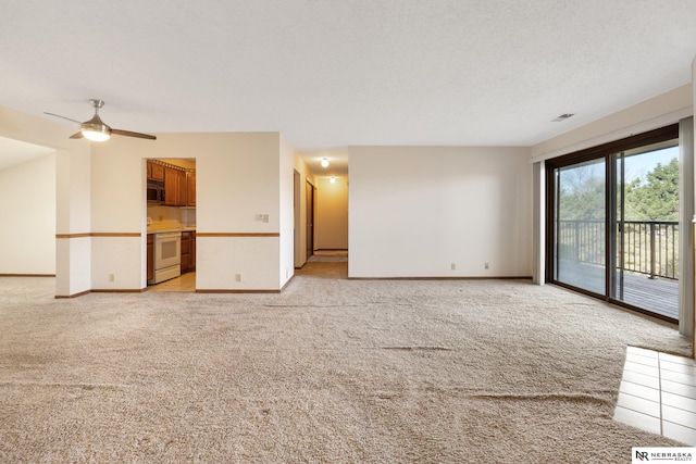 11937 Miracle Hills Dr Unit 11, Omaha, NE 68154 - unfurnished living room featuring light carpet and a ceiling fan