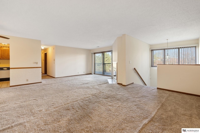 11937 Miracle Hills Dr Unit 11, Omaha, NE 68154 - unfurnished living room with carpet floors and a ceiling fan