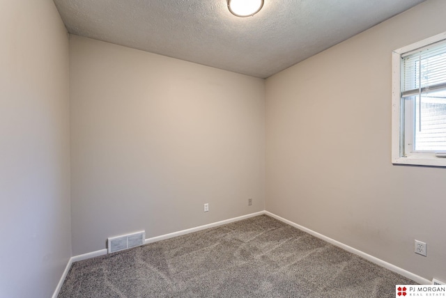 2811 S 36th St, Omaha, NE 68105 - spare room featuring carpet flooring and a textured ceiling