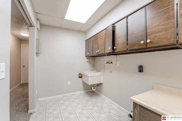 2811 S 36th St, Omaha, NE 68105 - laundry area featuring cabinet space and hookup for a washing machine