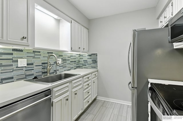 12727 W Dodge Rd Unit 124C, Omaha, NE 68154 - kitchen with stainless steel appliances, tasteful backsplash, light countertops, and white cabinetry