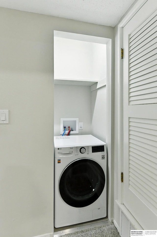 12727 W Dodge Rd Unit 124C, Omaha, NE 68154 - laundry area with washer / dryer and baseboards