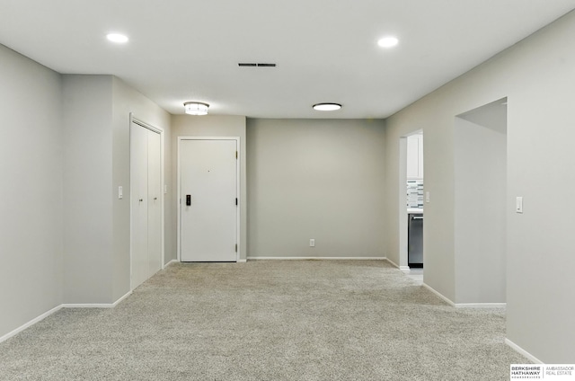 12727 W Dodge Rd Unit 124C, Omaha, NE 68154 - spare room with light colored carpet and recessed lighting