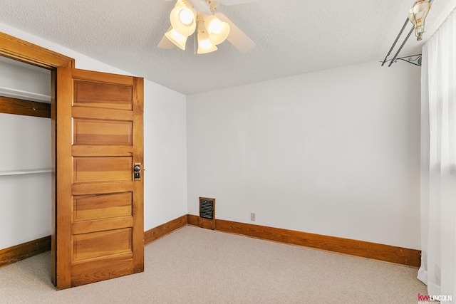 210 W Moravia Ave, Prague, NE 68050 - spare room featuring carpet floors, ceiling fan, and a textured ceiling