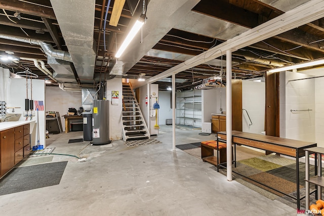 210 W Moravia Ave, Prague, NE 68050 - unfinished basement featuring electric water heater and stairs