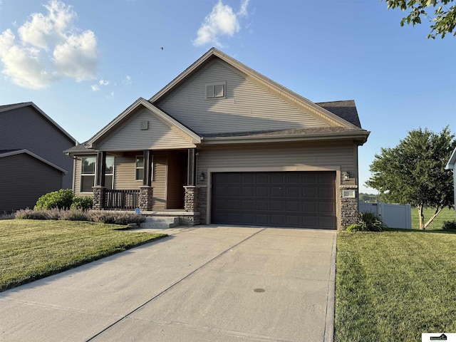 2308 Alexandra Rd, Papillion, NE 68133 - view of front of home with a porch, an attached garage, concrete driveway, and stone siding