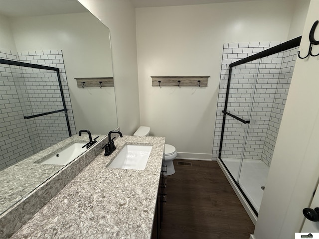 2308 Alexandra Rd, Papillion, NE 68133 - full bathroom with a stall shower, vanity, and wood finished floors
