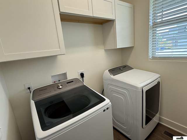2308 Alexandra Rd, Papillion, NE 68133 - laundry area featuring washer and clothes dryer, cabinet space, and dark wood-style floors