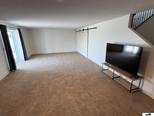 2308 Alexandra Rd, Papillion, NE 68133 - unfurnished living room featuring a barn door and carpet flooring