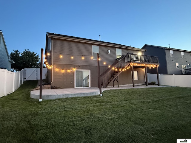 2308 Alexandra Rd, Papillion, NE 68133 - back of property featuring a gate, stairway, a fenced backyard, a patio area, and a deck