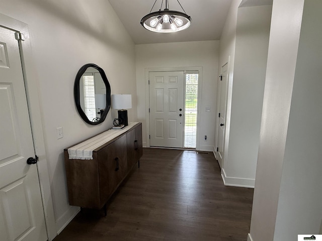 2308 Alexandra Rd, Papillion, NE 68133 - entrance foyer with a chandelier, dark wood-style floors, and vaulted ceiling