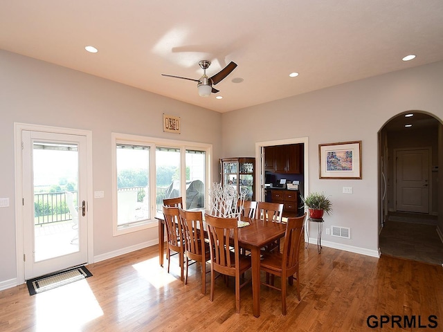 1526 Provencal Cir, Yutan, NE 68073 - dining space featuring arched walkways, a ceiling fan, light wood-style flooring, and recessed lighting