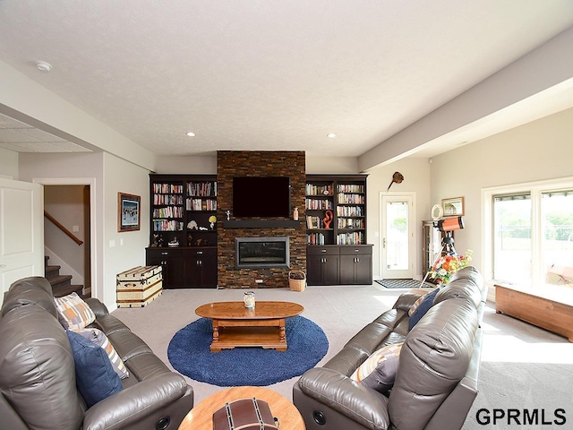 1526 Provencal Cir, Yutan, NE 68073 - living area with carpet floors, a fireplace, and stairs
