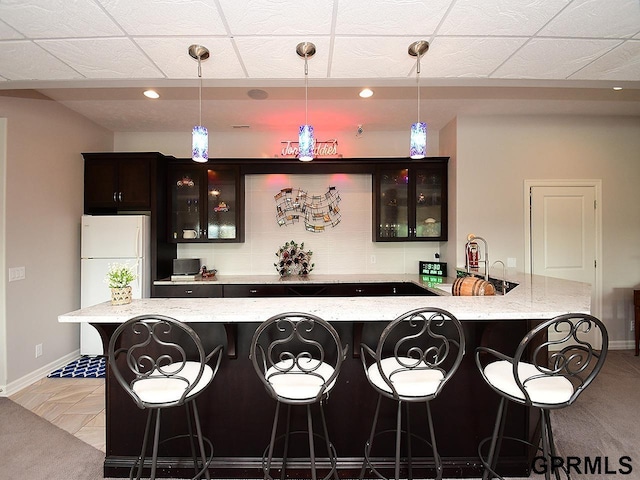 1526 Provencal Cir, Yutan, NE 68073 - indoor wet bar with hanging light fixtures, recessed lighting, and freestanding refrigerator
