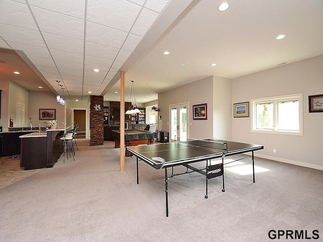 1526 Provencal Cir, Yutan, NE 68073 - playroom with light colored carpet, recessed lighting, a community bar, and french doors