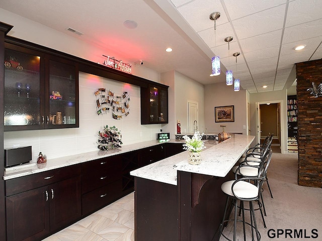 1526 Provencal Cir, Yutan, NE 68073 - indoor wet bar with hanging light fixtures, light colored carpet, and recessed lighting