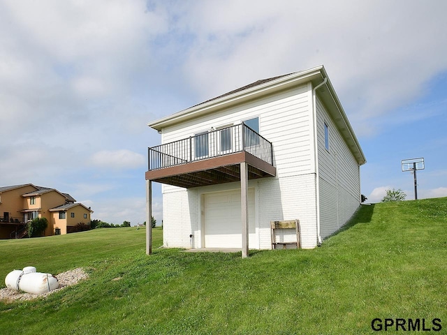 1526 Provencal Cir, Yutan, NE 68073 - back of house with brick siding, a garage, a lawn, and a balcony