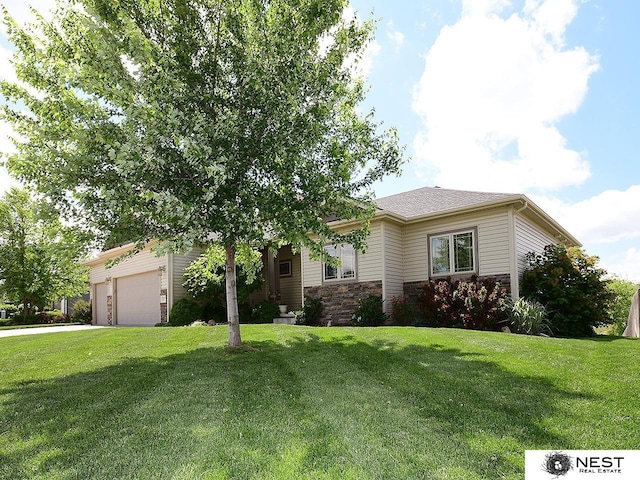 7521 Exbury Rd, Lincoln, NE 68516 - view of front of home featuring a garage, a front yard, driveway, and stone siding