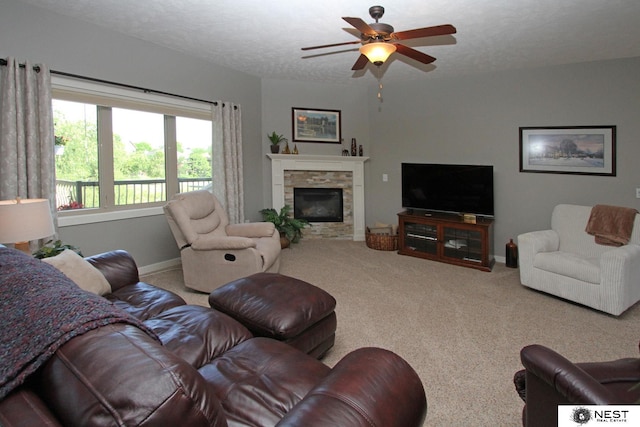 7521 Exbury Rd, Lincoln, NE 68516 - living area featuring carpet flooring, a ceiling fan, and a fireplace
