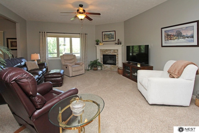 7521 Exbury Rd, Lincoln, NE 68516 - carpeted living area featuring ceiling fan and a fireplace
