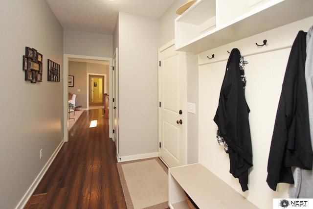 7521 Exbury Rd, Lincoln, NE 68516 - mudroom with dark wood-style floors and baseboards