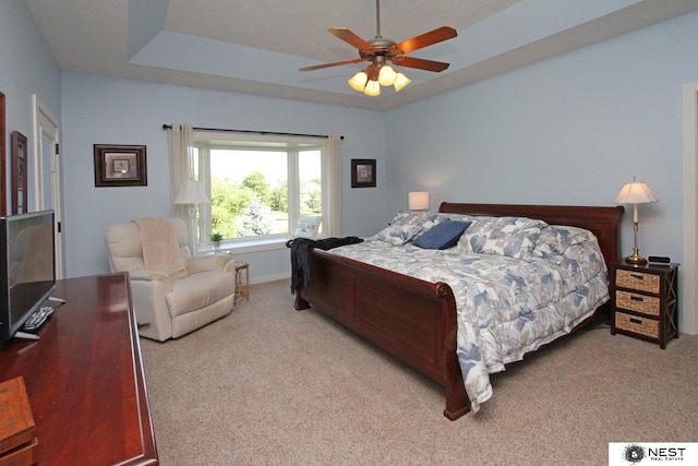 7521 Exbury Rd, Lincoln, NE 68516 - carpeted bedroom featuring ceiling fan and a raised ceiling