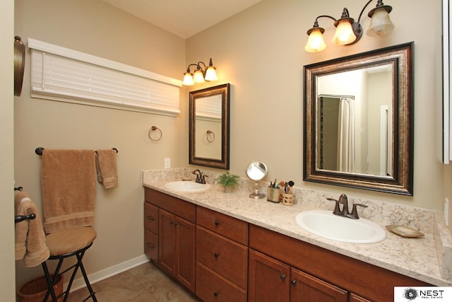 7521 Exbury Rd, Lincoln, NE 68516 - bathroom featuring double vanity and tile patterned floors