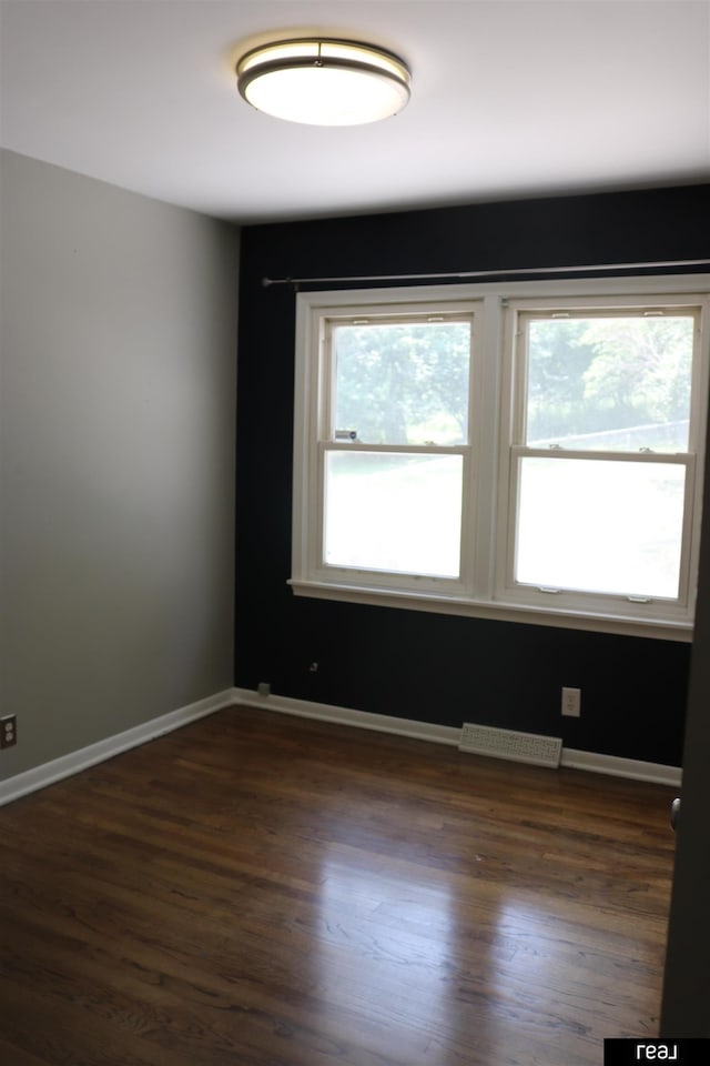 1912 Freeman Dr, Bellevue, NE 68005 - unfurnished room with dark wood-type flooring and baseboards