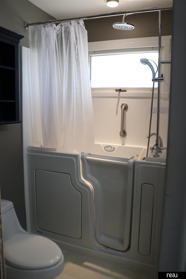 1912 Freeman Dr, Bellevue, NE 68005 - bathroom featuring toilet and curtained shower