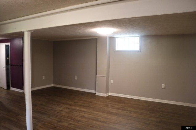 1912 Freeman Dr, Bellevue, NE 68005 - below grade area with dark wood-type flooring and baseboards