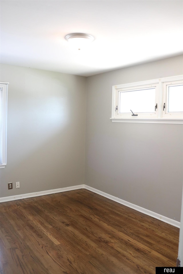 1912 Freeman Dr, Bellevue, NE 68005 - spare room featuring dark wood finished floors
