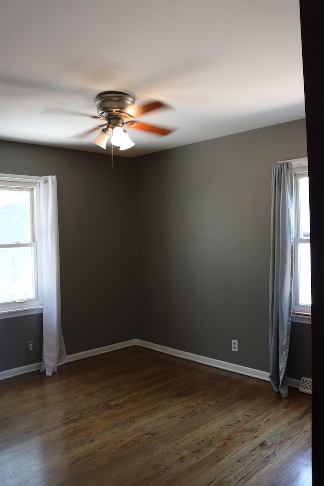 1912 Freeman Dr, Bellevue, NE 68005 - unfurnished room featuring ceiling fan and dark wood-style floors