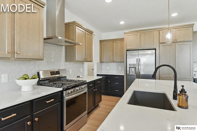 12386 Fenwick St, Papillion, NE 68046 - kitchen with stainless steel appliances, wall chimney range hood, tasteful backsplash, light stone counters, and dark cabinets