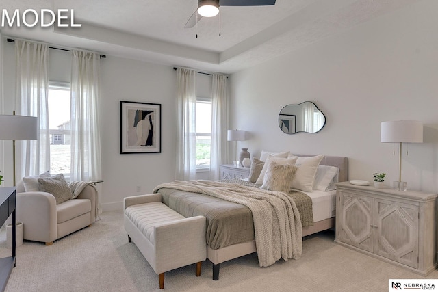 12386 Fenwick St, Papillion, NE 68046 - bedroom featuring light colored carpet, ceiling fan, and a raised ceiling