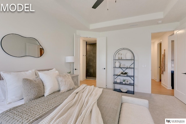 12386 Fenwick St, Papillion, NE 68046 - bedroom featuring a ceiling fan, a raised ceiling, and light colored carpet