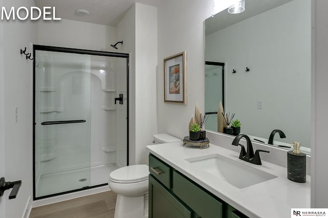 12386 Fenwick St, Papillion, NE 68046 - full bath with a shower stall, wood finished floors, and vanity