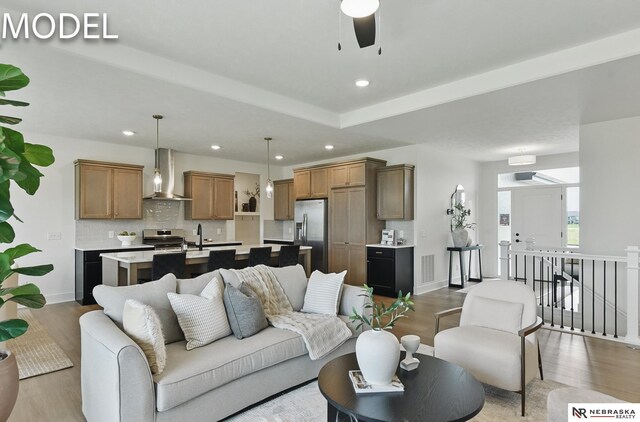 12386 Fenwick St, Papillion, NE 68046 - living room with light wood finished floors, recessed lighting, and a ceiling fan
