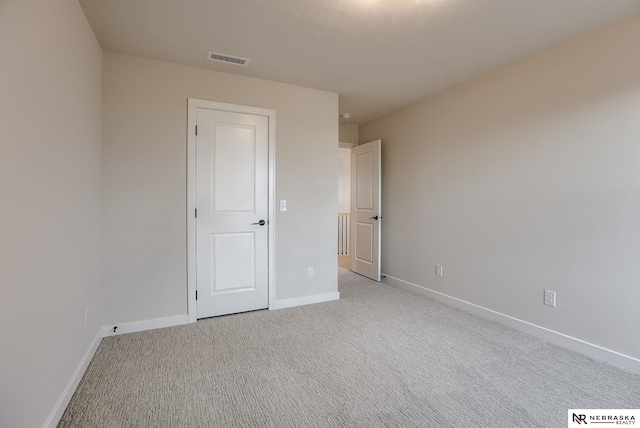12382 Fenwick St, Papillion, NE 68046 - unfurnished bedroom featuring baseboards and light carpet