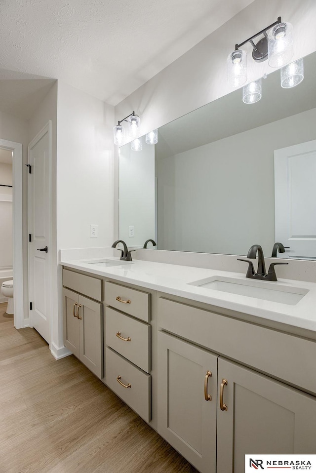 12382 Fenwick St, Papillion, NE 68046 - full bath with double vanity and wood finished floors