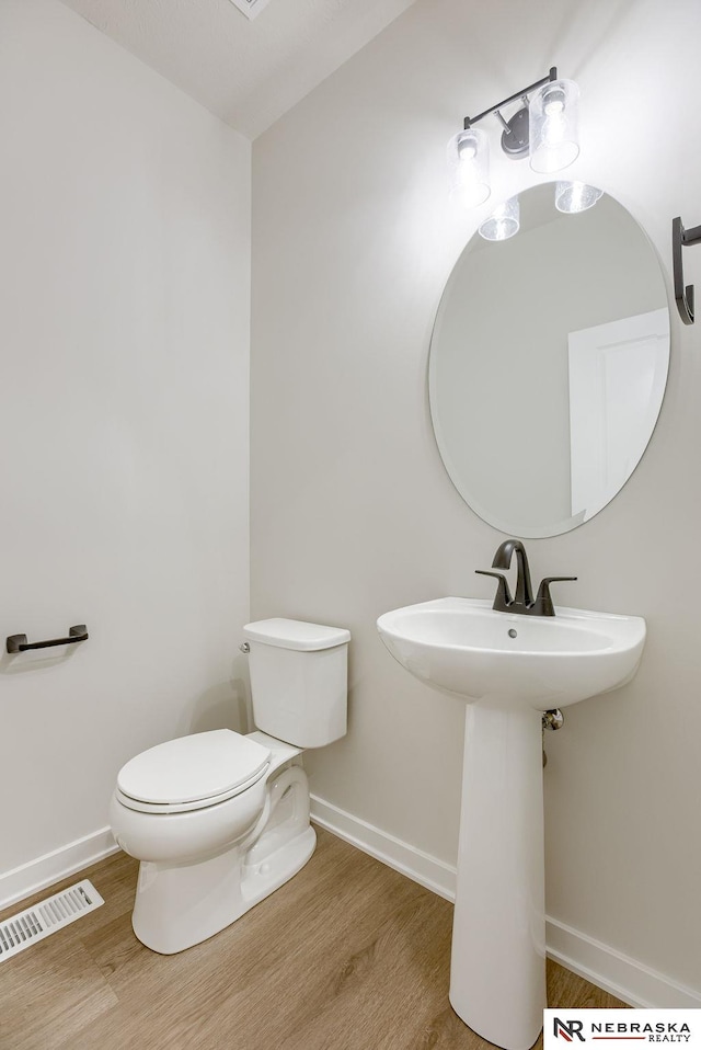 12382 Fenwick St, Papillion, NE 68046 - half bathroom featuring wood finished floors