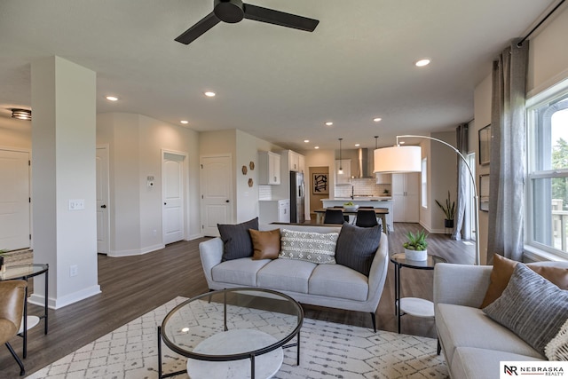 19015 Ranch Dr, Papillion, NE 68046 - living area with wood finished floors, a ceiling fan, and recessed lighting